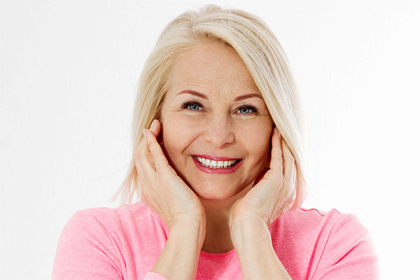 Woman with short hair and pink shirt