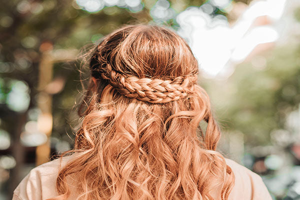 A red head women with braids around her crown