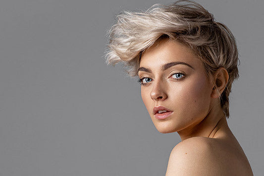 Woman with short hair with the grey background