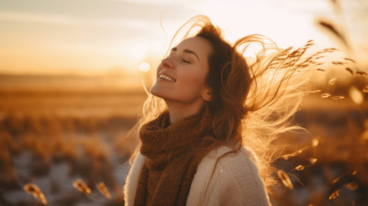 Woman in nature with her hair flowing.
